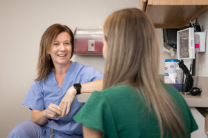 Dr. Sara Guzick speaking with a patient