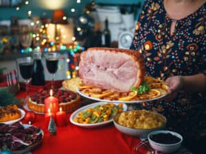 Serving ham at Christmas dinner